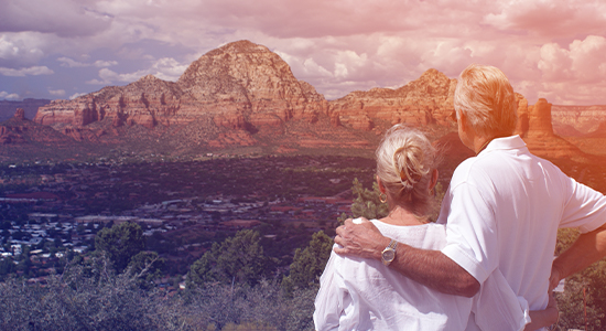 mature couple looking out at landscape